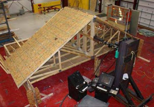 RESULTS Figure 8 Photo of test setup The results of the testing are summarized in Table 5 including the peak load reached by the roof assembly and the unit peak capacity of the truss-to-wall