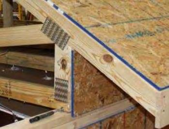 occurred at the edges of the OSB bracing strip. The bracing of heel joints with OSB was also effective in controlling rotation of the truss.