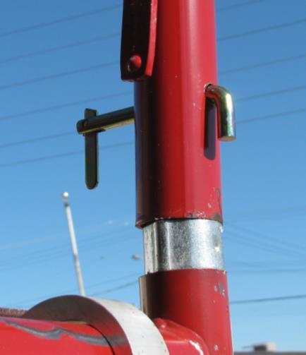 NEVER connect your lanyard to the guardrail or X-bracing. The second person is considered the helper.