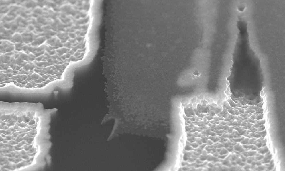Cross Contamination Source W Ti / TiN Oxide V_SEM Image The wafer surface has