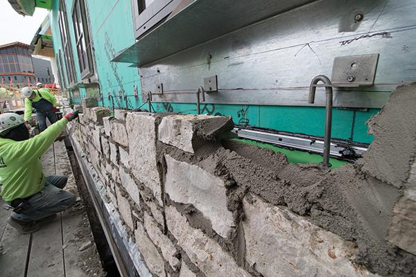 closely. When pre-blended mortar is properly used to support the units so the wall can set up quickly, shrinkage cracking is eliminated and more stone can be laid in a single day.