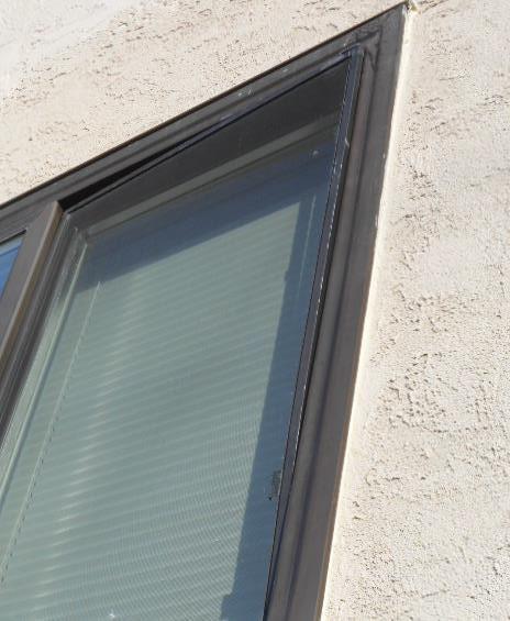 Picture 16 Image Location: SW Elevation Window Above Brick Fascia Comment: Retro-Fit Windows: The windows don't
