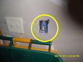 Electrical outlets and switches are missing covers.