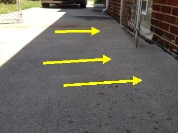 1. Driveway and Walkway Condition Grounds Materials: Concrete driveway noted. Concrete sidewalk noted. The driveway is improperly sloped towards the foundation.