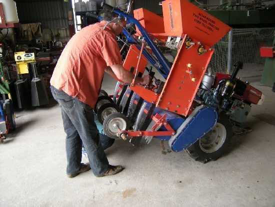 Jack carries out adjustments to the seed drill before giving a practical demonstration.