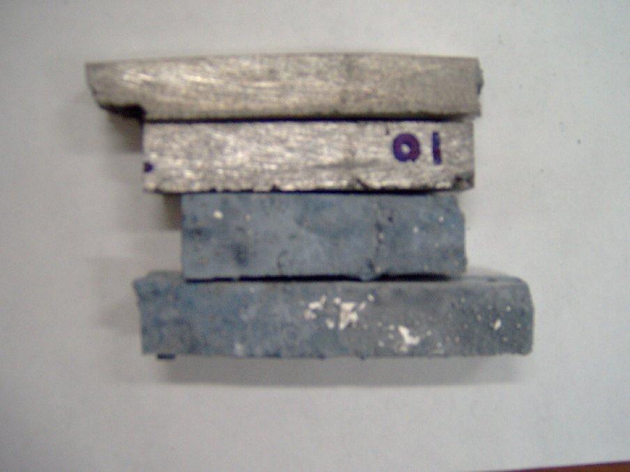 room temperature and 1000 o F. The bars measured at 1000 F show oxidation on the cut surfaces. Cubes (not shown) were used to determine crushing strength. Figure 7. Bars used for MOR testing.