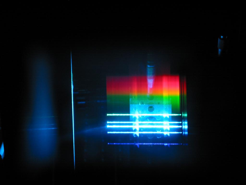 The visible fluorescence of the Bi 3+ :silica fiber became so strong that it can also be observed with the naked eye or easily be photographed through a straight vision prism (Fig. 6). Fig.