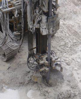 The jets erode and mix the in situ soil as the drill string and jet grouting monitor are rotated and raised slowly, forming columns.