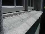 Detail #b. Lower window lacks sealant. Detail #b. -- This is a properly installed kick out flashing.