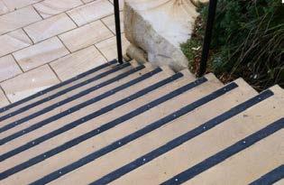 They must also be a minimum of 50 mm in width and not set back more than 15mm from the edge of the step.