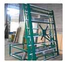 It uses both horizontal and vertical clamps to hold the frame in place. With the fixed member locked in with scissors, attaching the movable panel becomes simple and allows for testing.