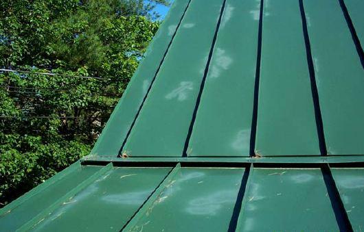 Walk in the flat of the panel between the corrugations and, as much as possible; walk at or near the supporting roof structural members.