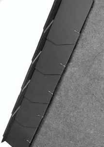 The foot connection with the chimney is obtained using a metal flashing covering the slates with the same vertical overlap as the slates.