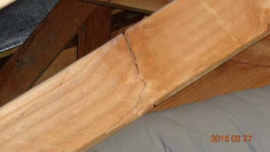 Cracked truss noted in attic.
