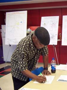 A TMA resident studies information at a Destination 2030 Open House.