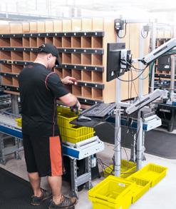 Once full, the single piece tote is sent to the packing area. All multi-piece orders are grouped into order totes based on the available cubbies located at order consolidation stations.