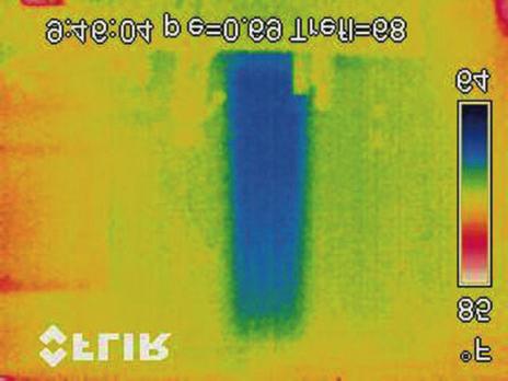This IR thermogram clearly identifies the source of a cold spot in a residential living room: a stud bay missed during blow-in insulation process.