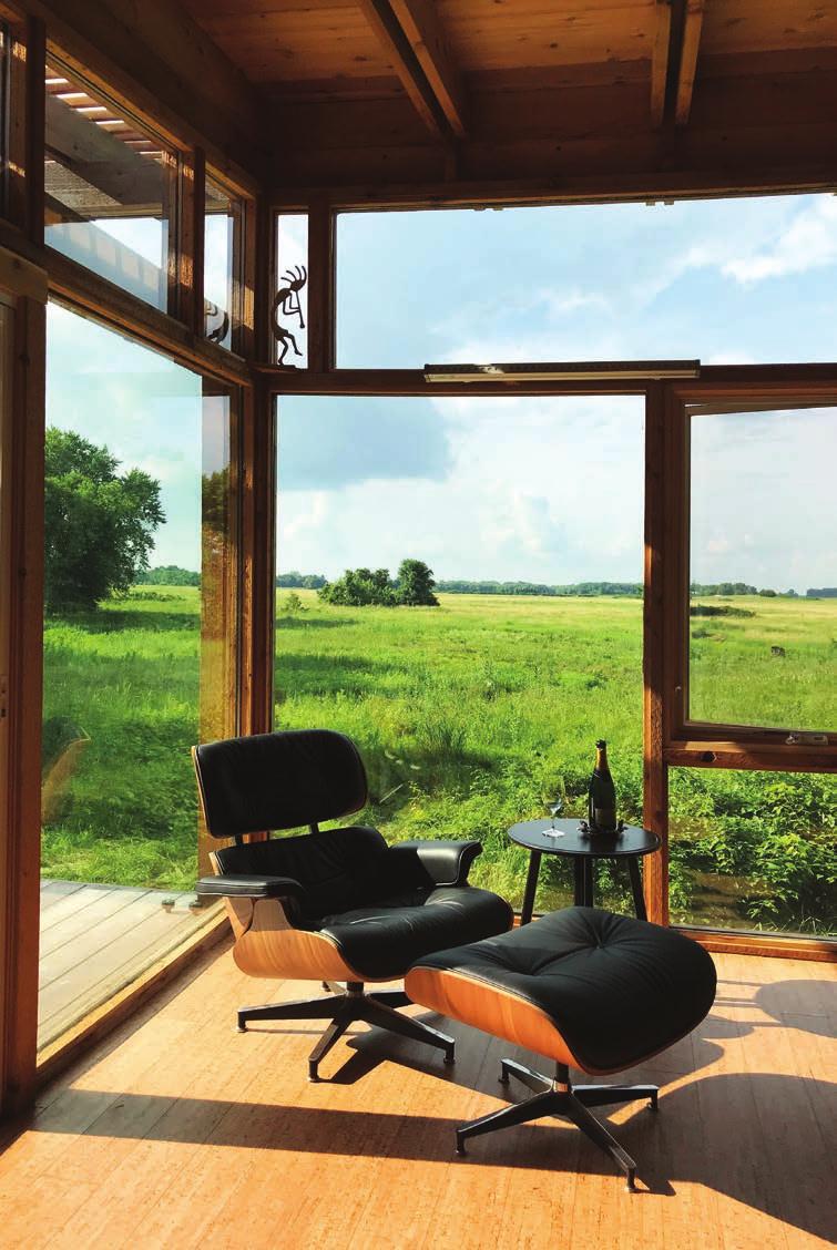 GLASS CABIN An Off-Grid Family Retreat Reclaimed Glass, Natural Materials and the Reclaimed Prairie on the land entrusted to the grandkids of a sesquicentennial farm was the genesis of the design for
