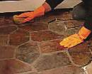 Spread the mortar out in an area that is slightly larger than the size of one piece of Mesh Flagstone.