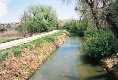 The portion of the canal segment on the west side of I-225 is approximately 350 feet long and follows a relatively straight east-west trajectory.