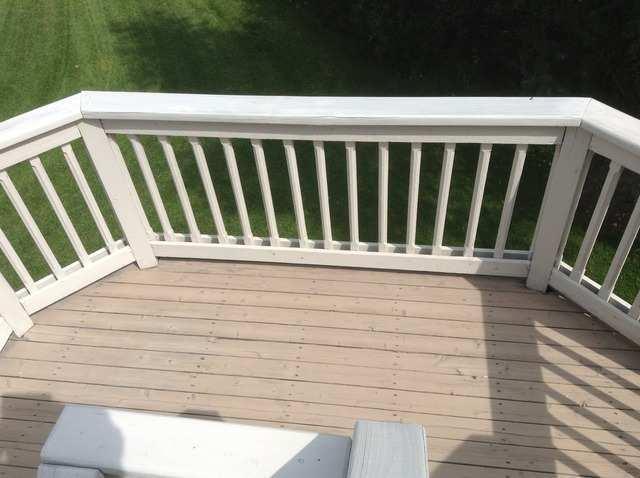 There were several nails sticking up from the deck boards, repairs are recommended. The visible portions of the cabinets and counter tops were in good condition.