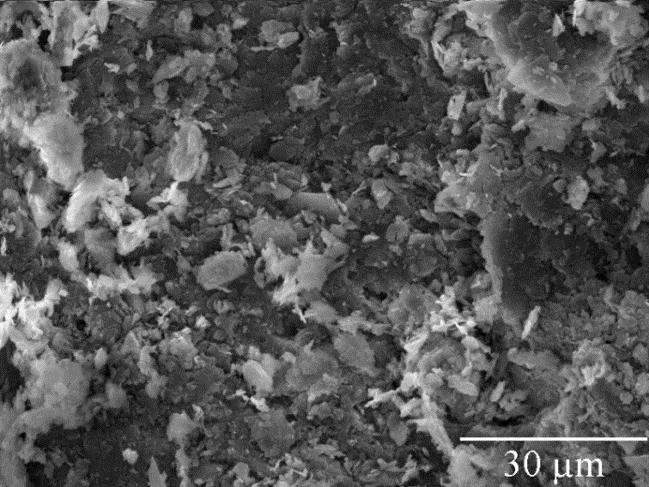 EO3 (6.35V) and in Figure 24 the dark part (oxide deposit) of the specimen in test EO3 (6.35V). No significant differences were observed. FIGURE 24 - TREATED KAOLIN DARK PART 4.