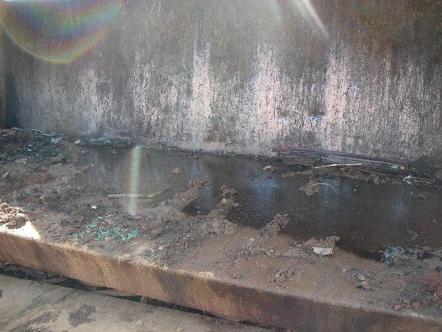 Description: bottom surface of crusher showing spilled fluids Photographer: Shan Lynch