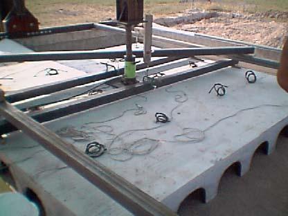 casted concrete. The load was then applied via the hydraulic jack up to the breakage of concrete slab, due to the typical mechanism of shear-bending rupture.