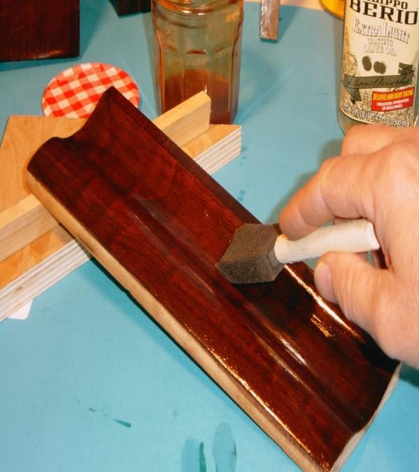 It is then rubbed to a final finish with a rubber and more shellac.
