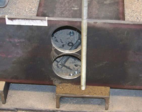 A middle plate and a bulk head were also placed inside this section of the box to shorten it, allowing pullout testing of short bars and making a space between them where a linear position sensor