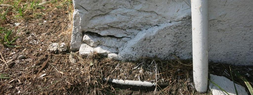 Cement parging has been used to cover the exposed