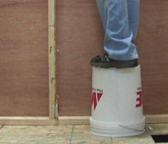 ENSURE THE WALL IS PLUMB Stud walls are often deceptive when it comes to being plumb and straight from top to bottom.