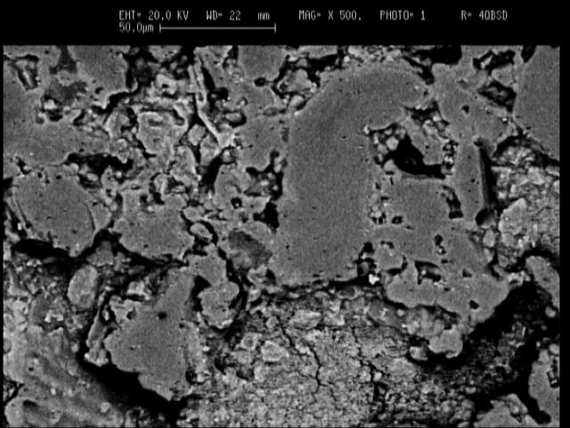 SEM micrographs of MC sample after firing at 14 C, in magnification of c)