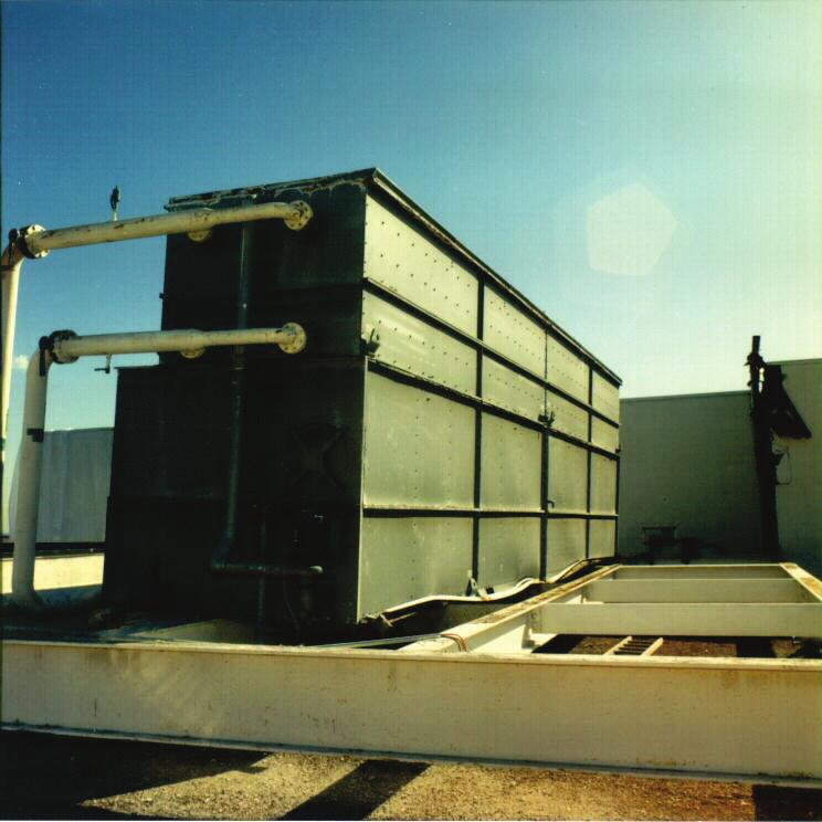 Figure 6.4.1.3-4 Rooftop equipment on isolators collapsed onto skid (Photo courtesy of Mason Industries).