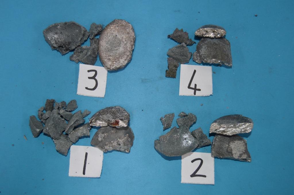Figure 9: An example of the bulk alloy pellet that forms and is collected from a smelting test (bright grey/silver = alloy) The %Cr values in the alloys were compared to one another.