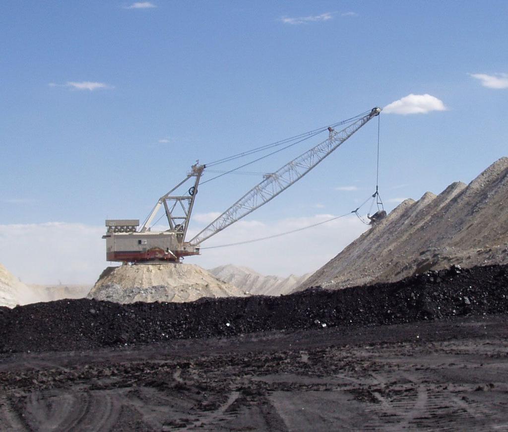 This machine is called a dragline. A bucket is dragged along the ground to collect coal.