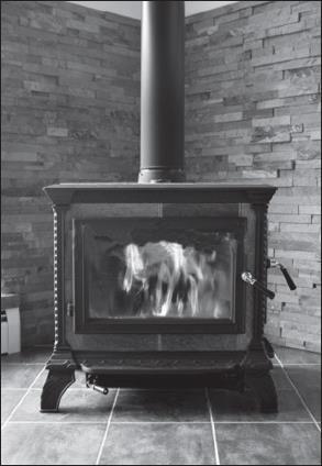 Photograph supplied by istockphoto/thinkstock The fire in the stove uses wood as a fuel. The fire heats the matt black metal case of the stove.