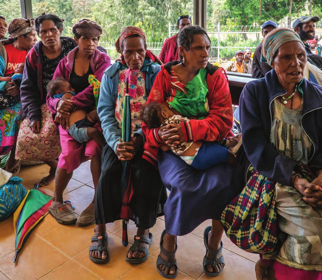 Mothers with their children waiting for routine check ups at the newly refurbished health post in Tambul District, Western Highlands Province.