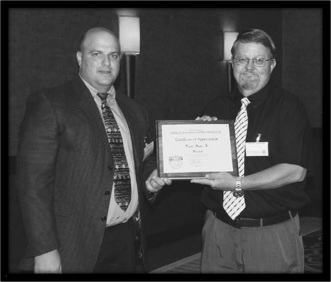 AAPFCO MEMBERS AT THEIR FINEST At this past annual meeting in Austin Texas Mr. Mike Hancock, fertilizer administrator for the Office of Indiana State Chemist received the D.S. Coltrane Award.