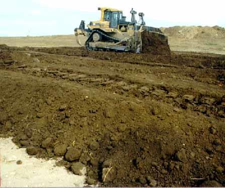 52 Soil may be hauled by tractor-scrapers or trucks.