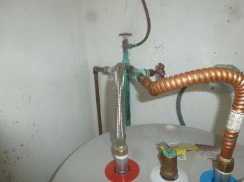 10. Overflow Condition The extension at the water heater relief valve is missing.