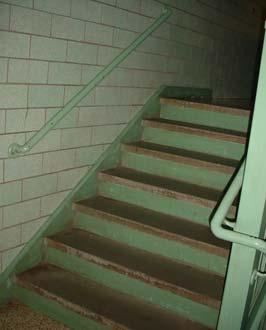 IN-06 Stairwells: Interior stair treads lack non-slip nosings. Handrails do not meet ADA requirements.