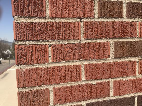 unreinforced brick masonry.
