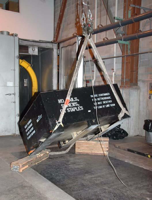 TEST PROCEDURES AND RESULTS Figure 7. Cornerwise Drop Test 5. Incline Impact Test (With Timber) The loaded container was placed on the carriage of a CONBUR incline-impact machine.