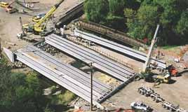 the precast concrete manufacturer to augment those reused. The voided slab beams for the detour bridges have since been sold and used in other detour bridges throughout the state.