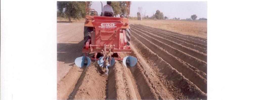 Fig. 19: A view of potato planter in operation Fig.