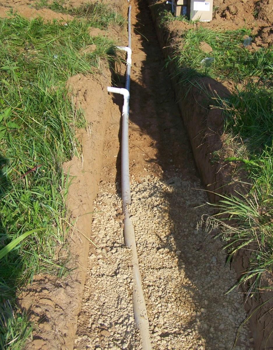 It must be large enough to pressurize the network and ensure uniform distribution and it must not be larger than the trench storage volume available below the drilled holes.