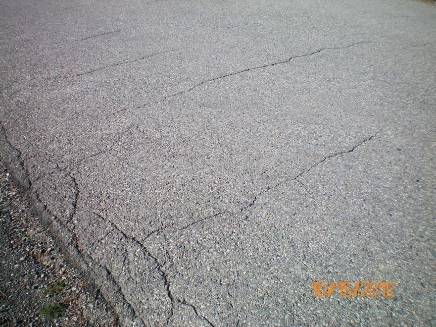 RATING 5. FAIR- Roads are still in good structural condition but clearly need seal coating or overlay. They might have moderate to severe surface raveling with significant loss of aggregate.
