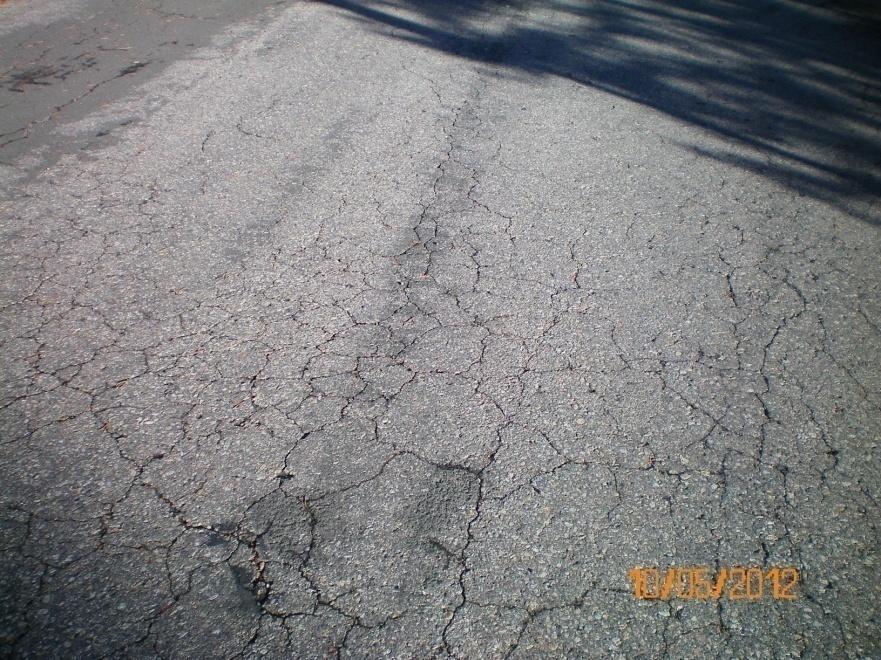 RATING 4. FAIR- Roads show first signs of needing strengthening by overlay. They have very severe surface raveling which should no longer be sealed. First longitudinal cracking in wheel path.
