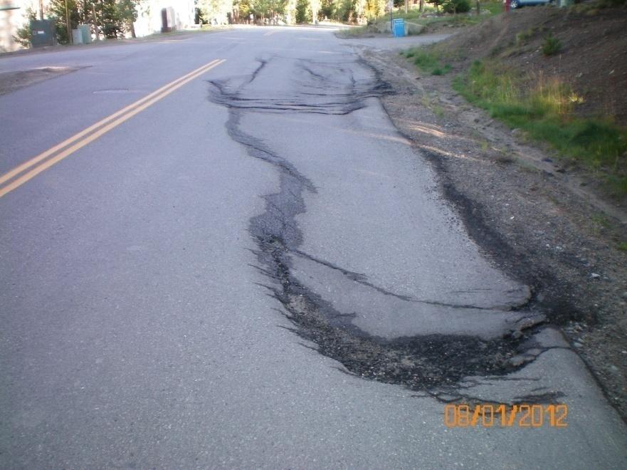 Reflection Cracks Asphalt overlay over concrete Slippage Cracks Crescent or rounded cracks in the direction of traffic are caused by